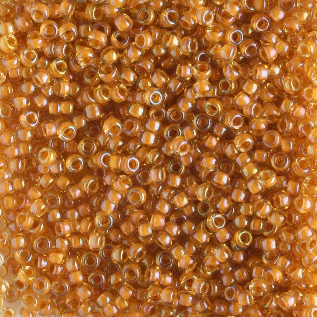 15/0 Apricot Lined Topaz - 5 grams