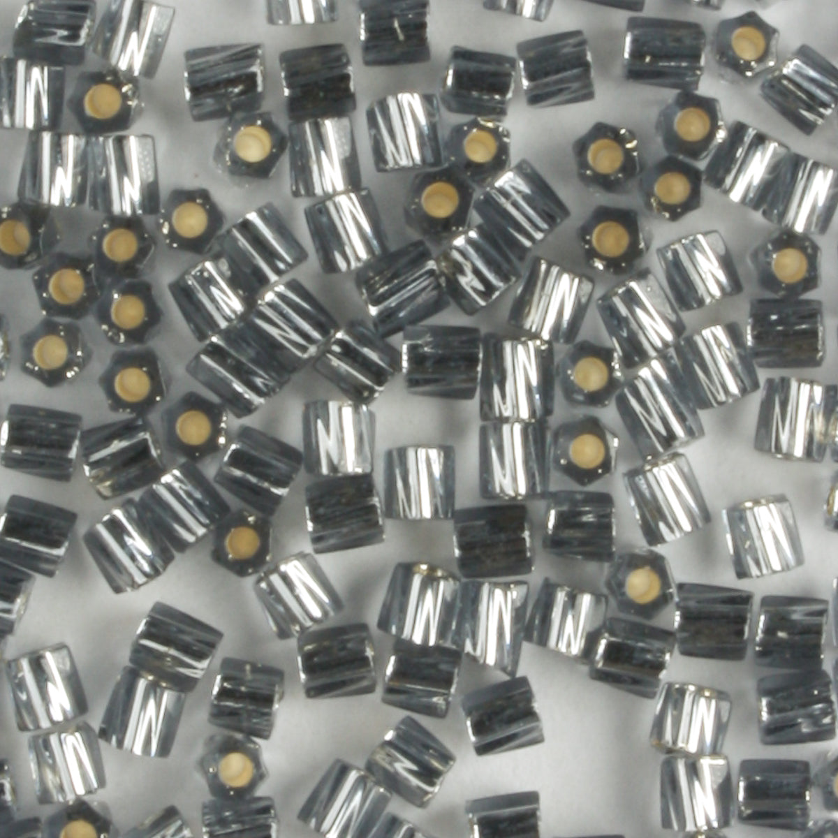 10/0 Hex Cut with a Twist Silver Lined Smokey Gray - 10 grams