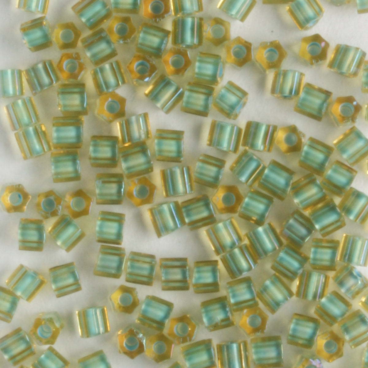 11/0 Triangle Seafoam Lined Topaz - 10 grams