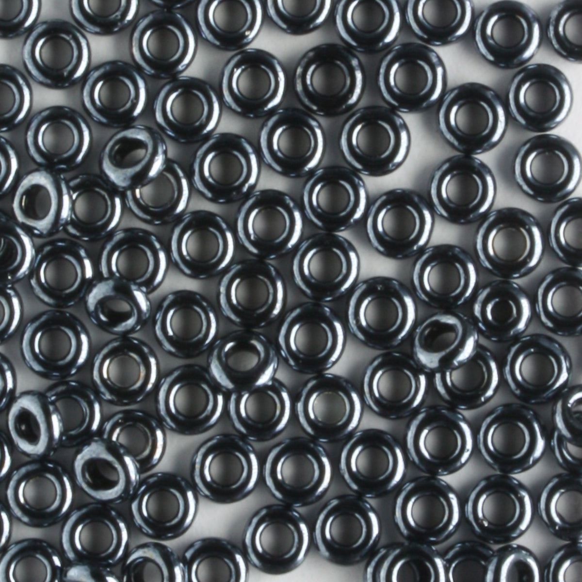 8/0 Demi Round Metallic Hematite - 10 grams