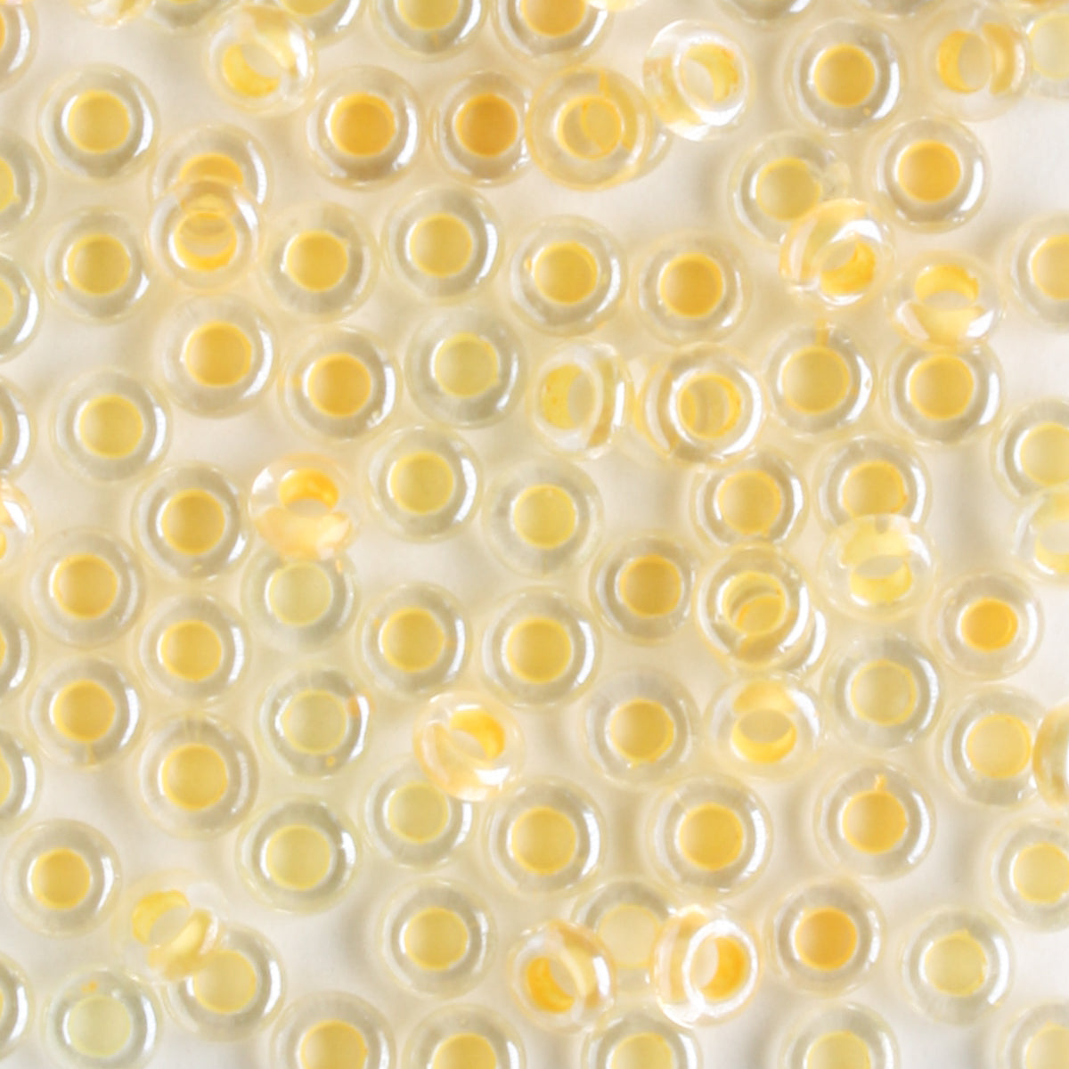 8/0 Demi Round Custard Lined Crystal - 10 grams