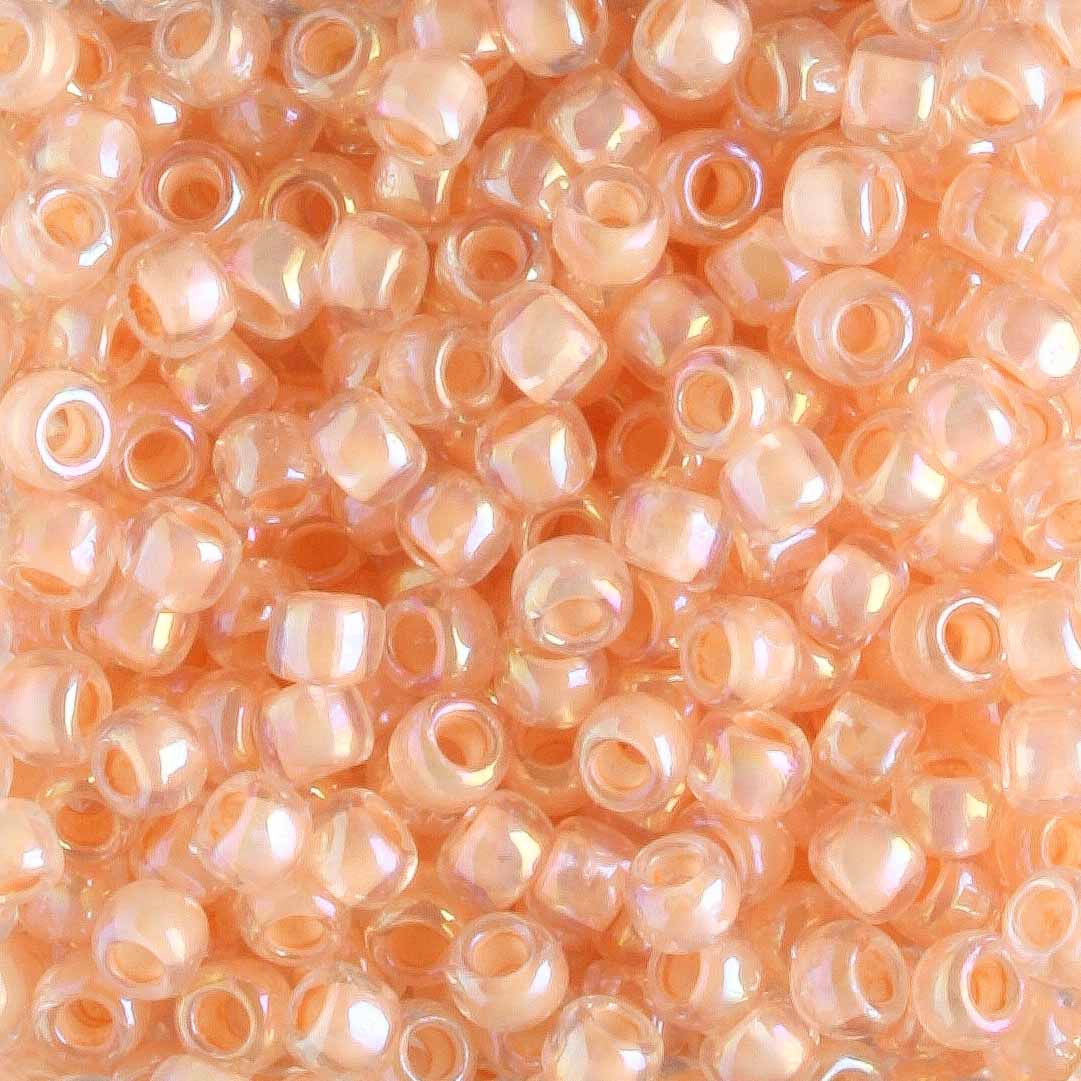 8/0 Apricot Lined Rainbow Crystal - 10 grams